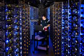 An engineer examining servers at a Google data centre in the US. Photo: Google