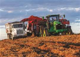 John Deere 8 Series tractor with Spudnik potato harvester