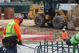 A construction worker handles rebar at a work site in Houston, Texas